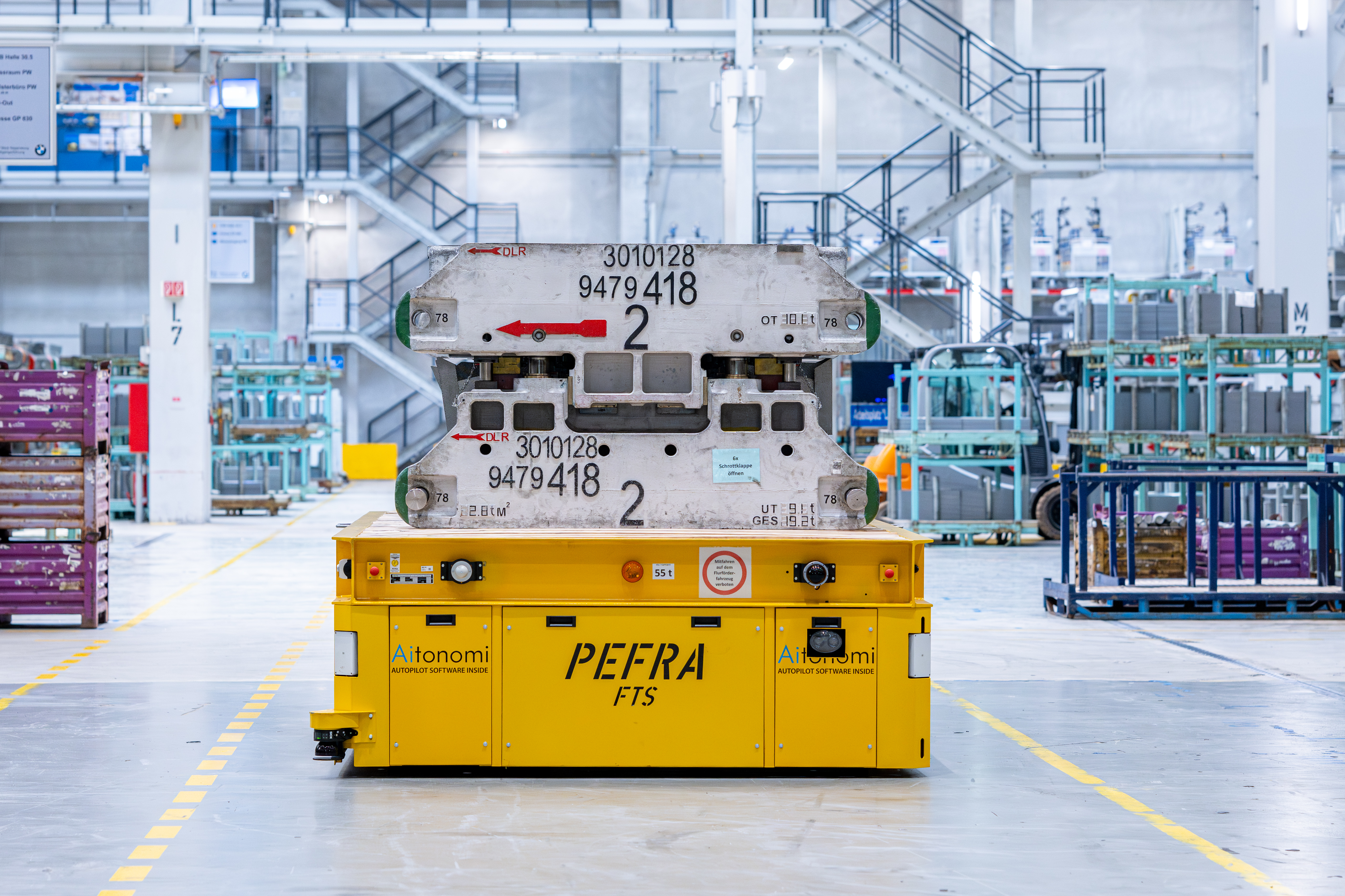 BMW Group Plant Regensburg press shop: autonomous, driverless transport vehicle navigates precisely through press shop (06/2024)